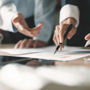 Businesswoman advisor, business people talking, planning analyze investment and marketing on tablet in office.